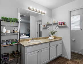 Primary en-suite bathroom with separate room for the commode