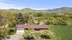View of subject property featuring a mountain backdrop