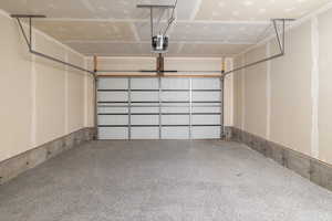 Garage featuring a garage door opener