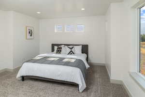 Bedroom with carpet, recessed lighting, and baseboards