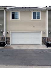 Garage with cooling unit and driveway