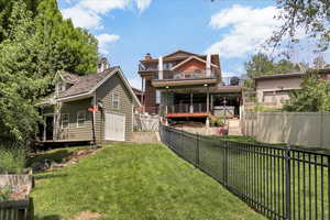 Back of house featuring a wooden deck