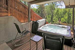 Wooden deck with a hot tub
