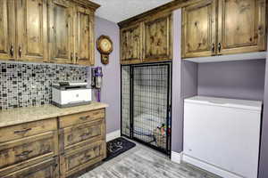 Clothes washing area with baseboards