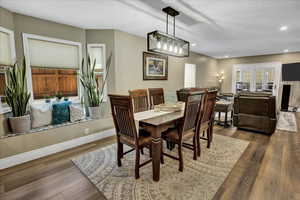 Dining room featuring wood finished floors, recessed lighting, and baseboards
