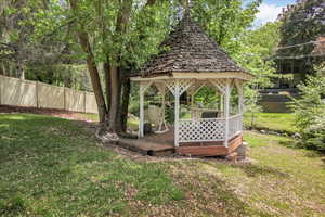 View of yard with a gazebo and a wooden deck