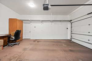Garage featuring a garage door opener