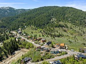 View of property location featuring a heavily wooded area and mountains