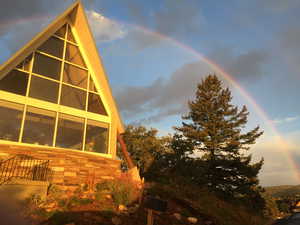 View of side of property featuring stone siding