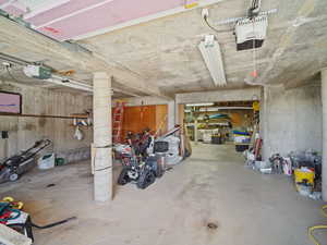 Garage featuring a garage door opener
