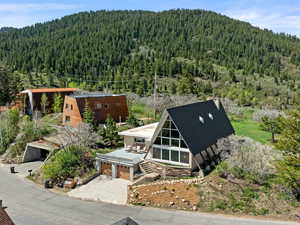 View from above of property with a heavily wooded area