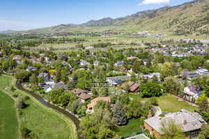View of property location featuring a mountainous background and nearby suburban area