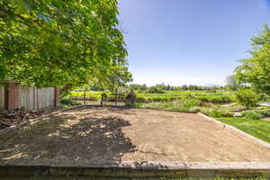 View of yard featuring fence and a view of countryside