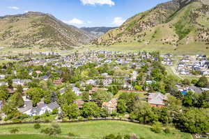 Aerial view of residential area featuring a mountainous background