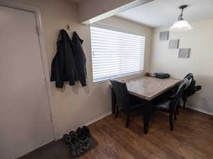 Dining room with wood finished floors and baseboards