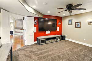 Home theater room featuring baseboards, ceiling fan, and recessed lighting