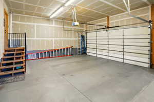 Garage featuring a garage door opener