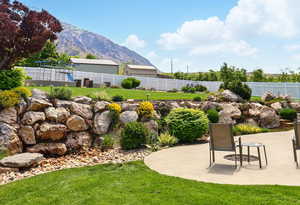 View of yard featuring a mountain view and a patio