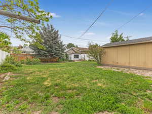 View of yard with an outdoor structure
