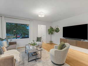 Living area featuring wood finished floors and baseboards