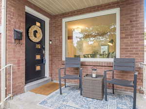 Entrance to property with brick siding
