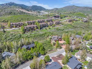 View of property location with mountains and nearby suburban area