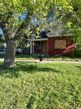View of front of house with a front yard