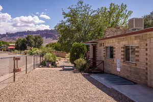 Fenced backyard featuring cooling unit and a mountain view