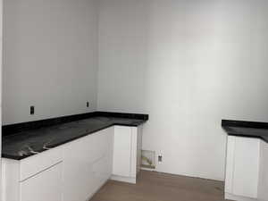 Laundry room featuring light wood finished floors