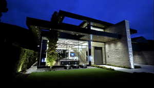 Back of house at twilight with stairway