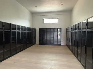 Interior space featuring a package area and a high ceiling