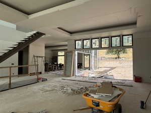 Miscellaneous room with plenty of natural light and stairs