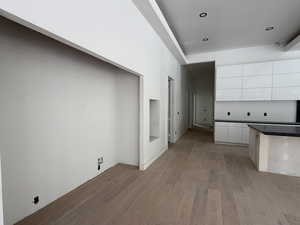 Kitchen with white cabinets, modern cabinets, dark wood-style floors, and recessed lighting