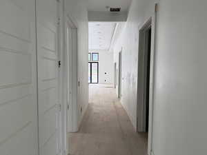 Corridor with light wood-style floors