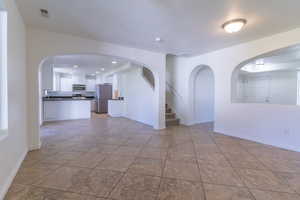 Unfurnished room featuring recessed lighting, baseboards, and a sink
