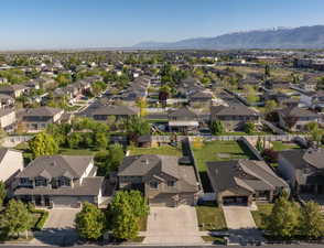 Aerial view of residential area featuring a mountainous background