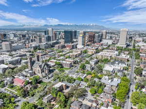 Aerial overview of property's location featuring a mountain backdrop and nearby urban area