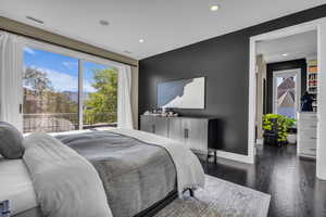 Bedroom featuring recessed lighting, wood finished floors, and baseboards