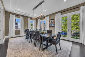 Dining room with french doors, a chandelier, recessed lighting, baseboards, and wood finished floors