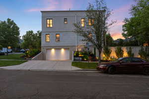 View of front of house featuring driveway and a garage