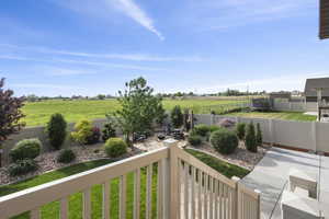 View of backyard with field behind home