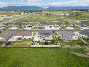 Aerial view of fully fenced home and backyard
