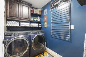 Laundry room, cabinet space, and drying racks