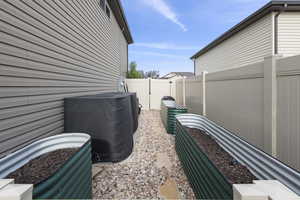 Raised garden and 2 large water storage containters
