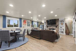 Living room/entertaining room with bookshelves and fireplace