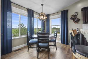 Dining space featuring a chandelier, plenty of natural light