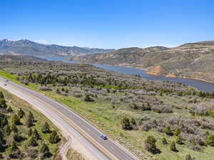 View of mountain backdrop featuring a nearby body of water