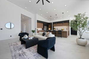 Living room featuring recessed lighting, ceiling fan, high vaulted ceiling, and baseboards