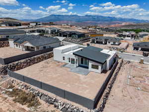 Aerial perspective of suburban area with a mountain backdrop