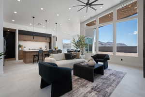 Living area featuring recessed lighting, a mountain view, and a ceiling fan